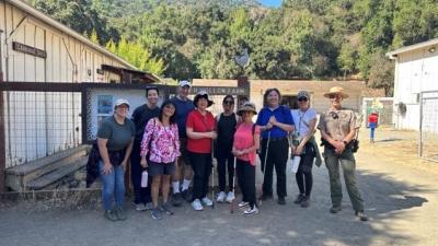 Group of Vista Center hike participants take a group photo at Deer Hollow Farm in Rancho San Antonio Preserve