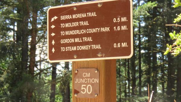 Trail sign includes a junction number that matches numbering on preserve maps