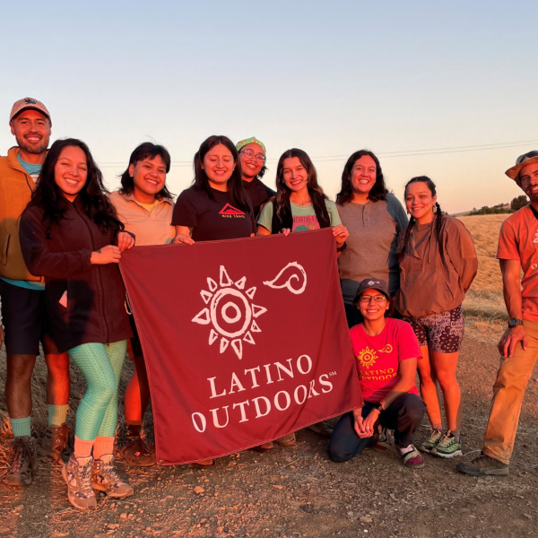 Latino Outdoors members holding banner at Monte Bello Preserve